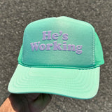He’s Working — Custom Puff Print Trucker Hat