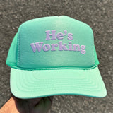 He’s Working — Custom Puff Print Trucker Hat